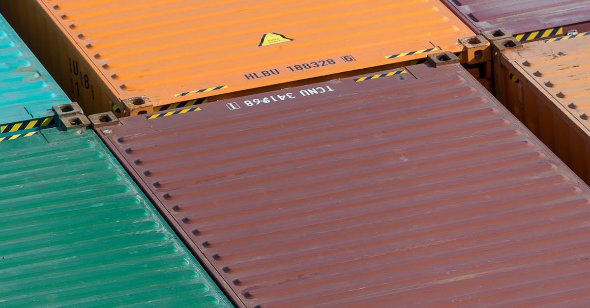 Aerial view of vibrant cargo containers arranged in a pattern, emphasizing logistics and transportation.