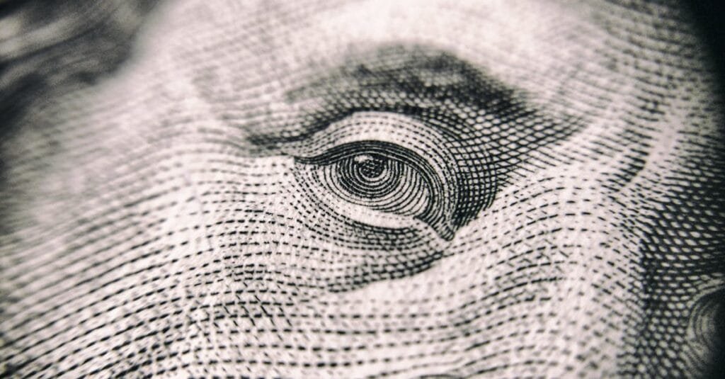 Detailed close-up of a banknote's eye, showcasing its intricate texture and design.