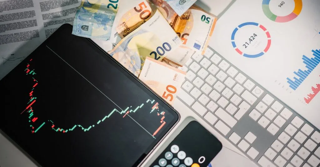 Overhead view of financial tools with Euro banknotes on a desk showing market trends and graphs.