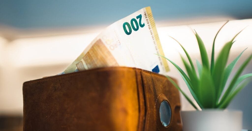 leather wallet with protruding banknote home interior