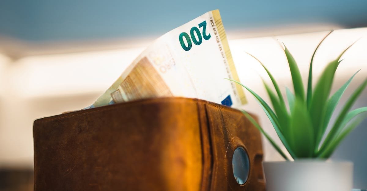 leather wallet with protruding banknote home interior