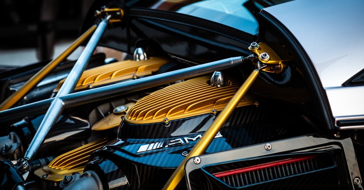 Detailed view of a luxury hypercar engine with gold and carbon fiber elements.