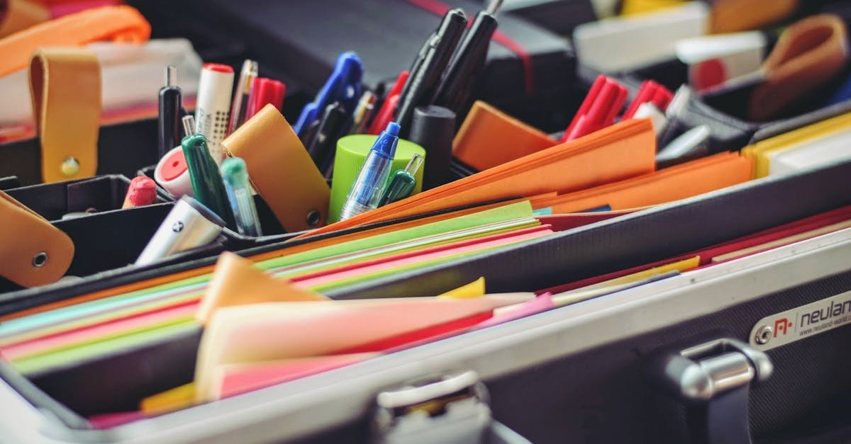 A collection of colorful office supplies neatly arranged in a suitcase, perfect for professionals on the go.