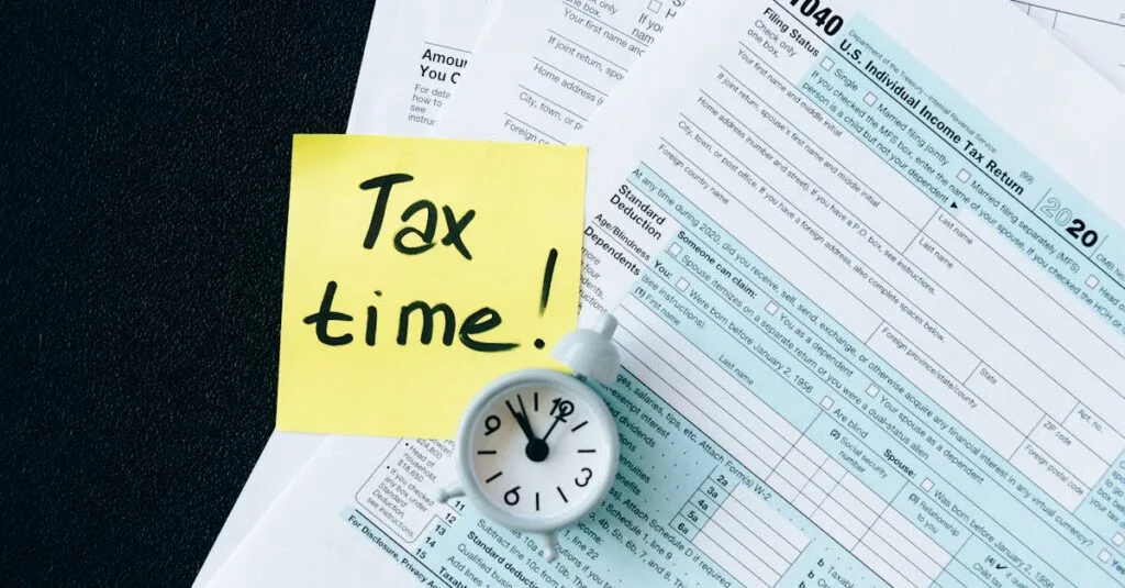 A stack of tax forms with a clock and yellow sticky note saying 'Tax time!' indicating urgency.
