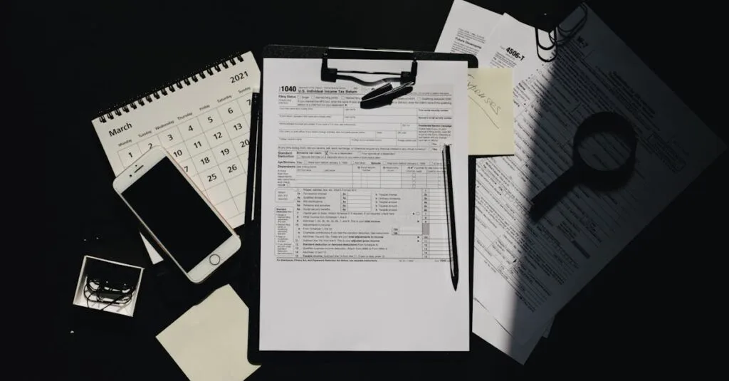 Flat lay of tax documents, calendar, and smartphone on a dark surface, symbolizing tax preparation.