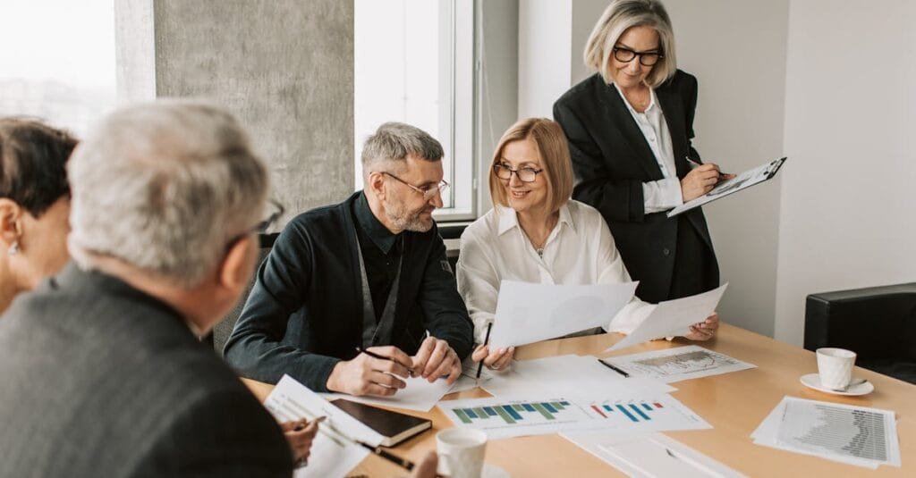 A diverse group of business professionals engaged in a strategic meeting.