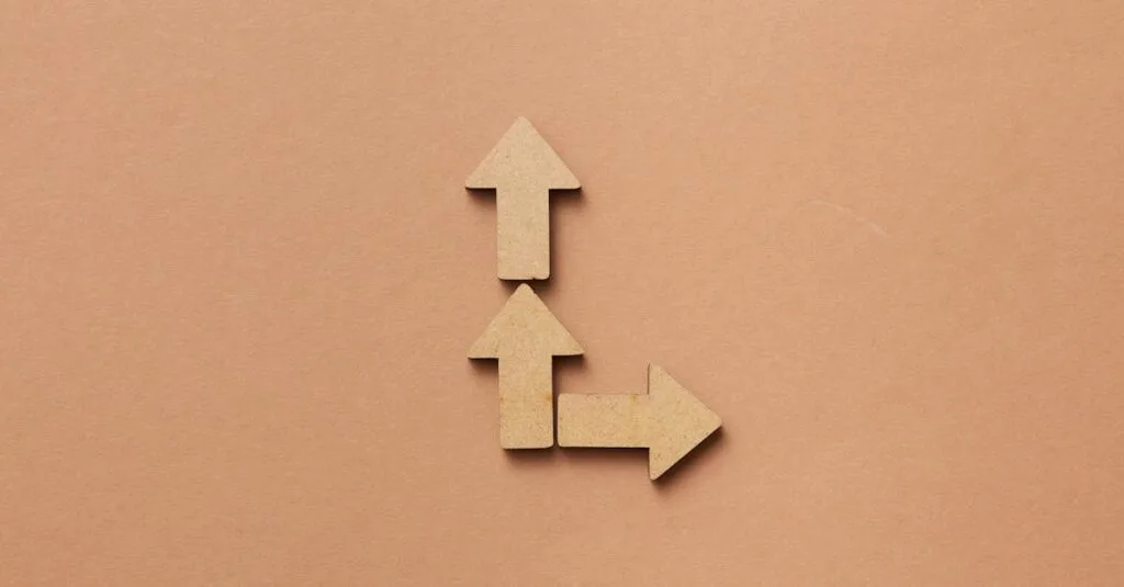 Three cardboard arrows arranged on a brown background, symbolizing direction and choice.