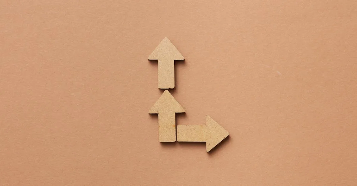 Three cardboard arrows arranged on a brown background, symbolizing direction and choice.