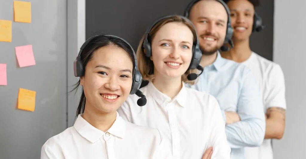 Smiling customer service team wearing headsets in an office setting, ready to assist clients.