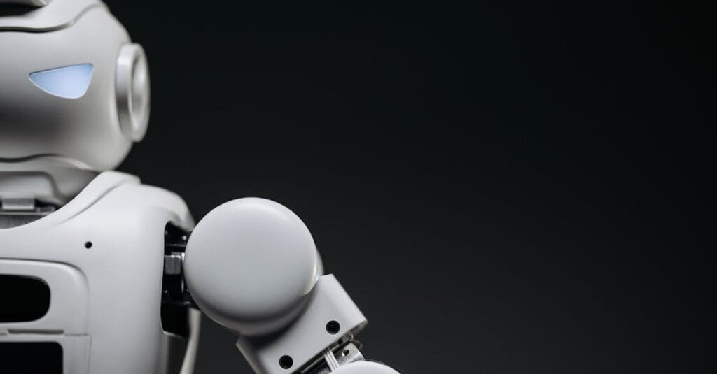 Close-up of a modern, monochrome robot arm against a dark background. Futuristic technology concept.