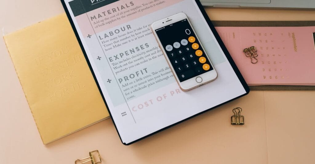 Organized business tools with a smartphone, documents, and stationery in a flat lay format.