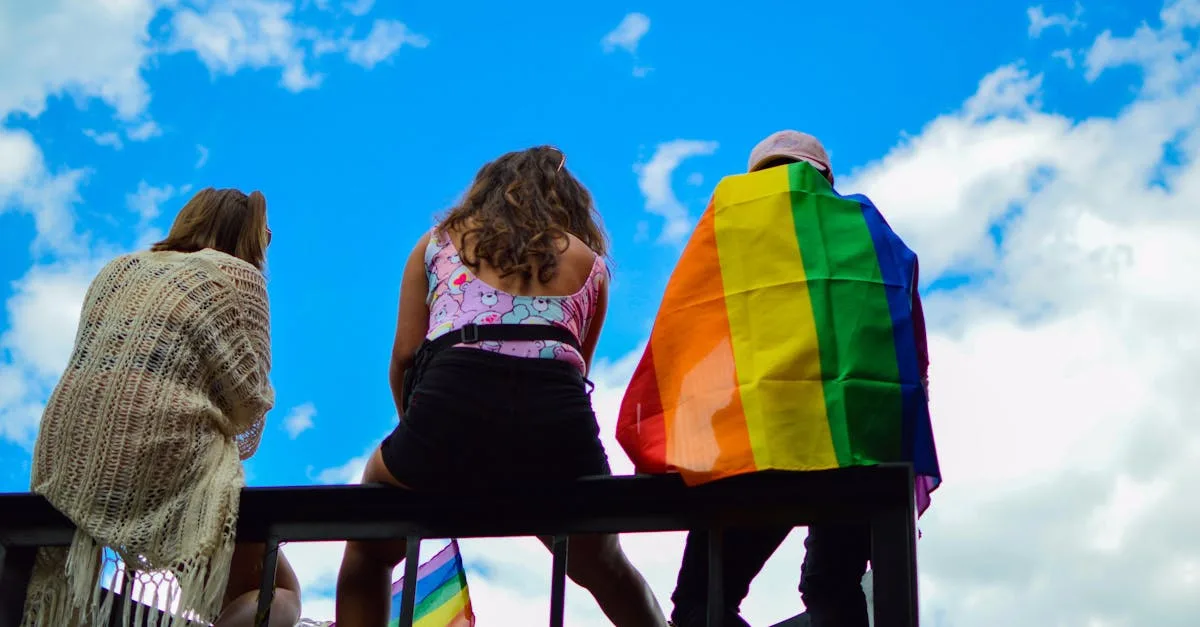 A vibrant scene of unity and pride with diverse individuals enjoying a sunny day together.