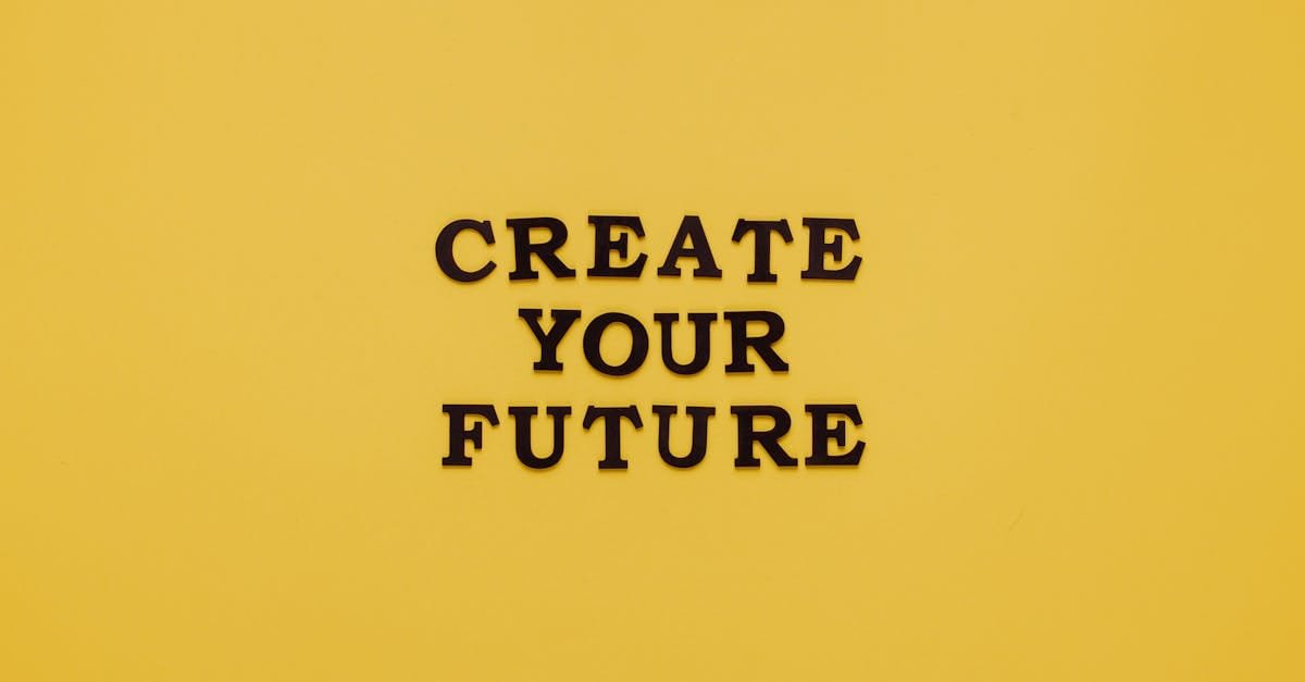Bold text 'CREATE YOUR FUTURE' on minimalist yellow background. Inspiring design.