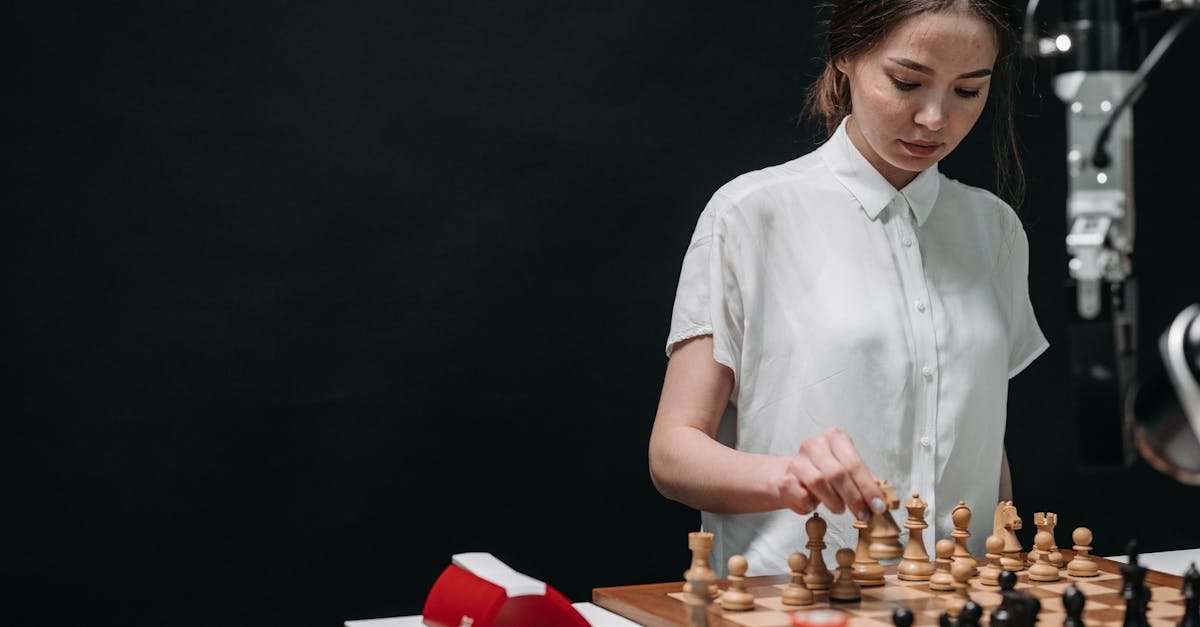 A woman plays chess against an articulated robot, symbolizing AI and human collaboration.
